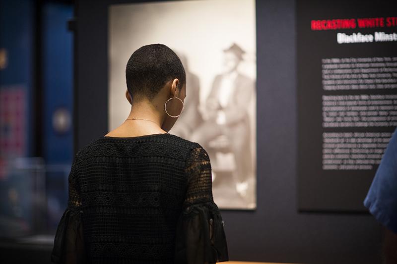 Emory Libraries patron viewing the Billops Hatch Exhibition