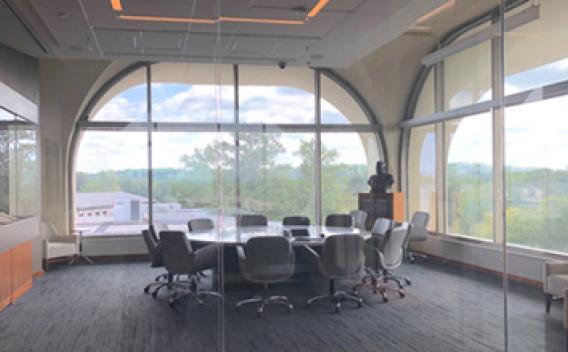 Rose Library conference room with large glass windows overlooking the campus