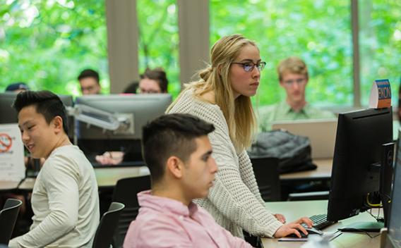 Students working on their final projects in the Goizueta Business Library