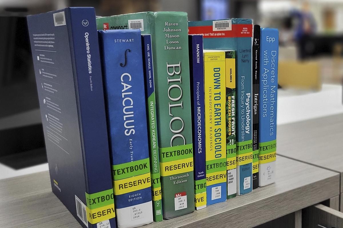 Reserve textbooks on a library shelf